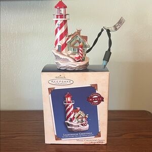 Hallmark Keepsake Red and White Lighthouse Ornament. Magic collectors series.